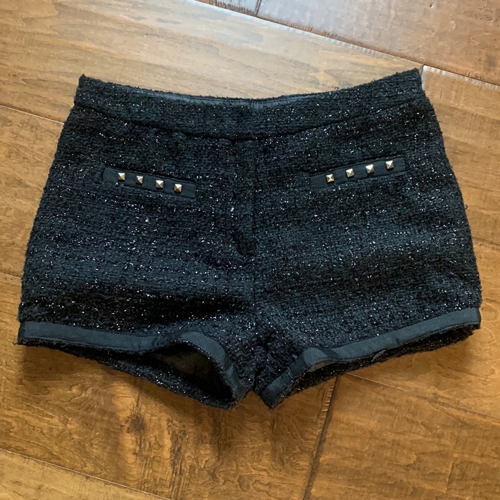 Women’s medium polyester shorts. Gold studs on front, great condition.